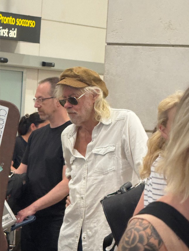 Bob Geldof at Venice's Marco Polo airport. Multi-millionaire Bob Geldof has been spotted flying back to the UK from Italy on Ryanair, telling a fellow traveller: 'I don't spend on luxury travel'. The Boomtown Rats frontman - worth an estimated ?111m ($150m) - was spotted waiting at the check-in queue for the budget airline in shades with his bandmates at Venice's Marco Polo airport. The Live Aid founder, 73, told a fan he had recently played with the Rats in the Floating City. Jay Curtis, a travel content creator also flying to Bristol with Ryanair, says he was 'shocked' to see Geldof queuing for around an hour with other passengers. Photo released 20/07/2025