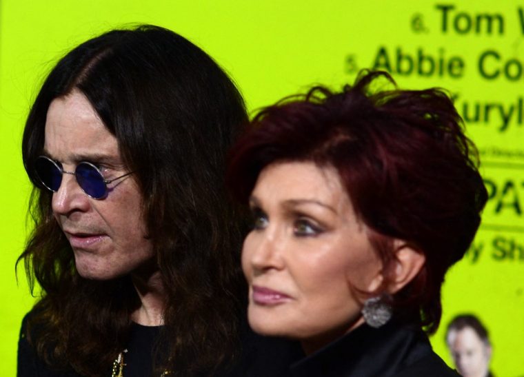 (FILES) Ozzy Osbourne and Sharon Osbourne arrive at the premiere of CBS Films' 'Seven Psychopaths' at Mann Bruin Theatre on October 1, 2012 in Westwood, California. Ozzy Osbourne, the frontman of heavy metal group Black Sabbath, died on July 22, 2025 at the age of 76, his family announced in a statement. "He was with his family and surrounded by love. We ask everyone to respect our family privacy at this time," the statement added. (Photo by Joe KLAMAR / AFP) (Photo by JOE KLAMAR/AFP via Getty Images)