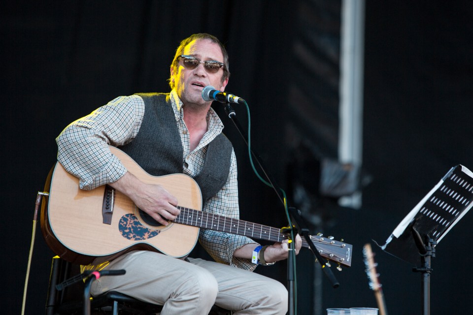 BINGLEY, UNITED KINGDOM - AUGUST 31: Simon Fowler of Ocean Colour Scene performs on stage at Bingley Music Live Festival at Myrtle Park on August 31, 2014 in Bingley, United Kingdom. (Photo by Andrew Benge/Redferns via Getty Images)
