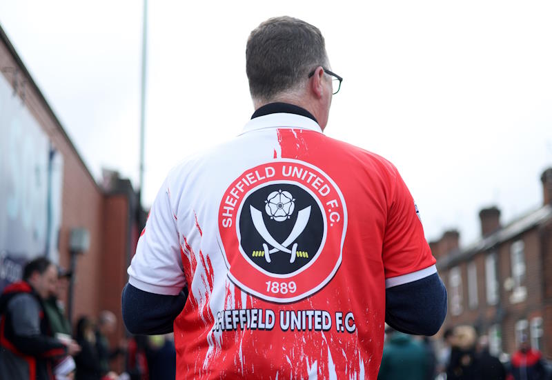 A Sheffield United fan makes his way to the match
