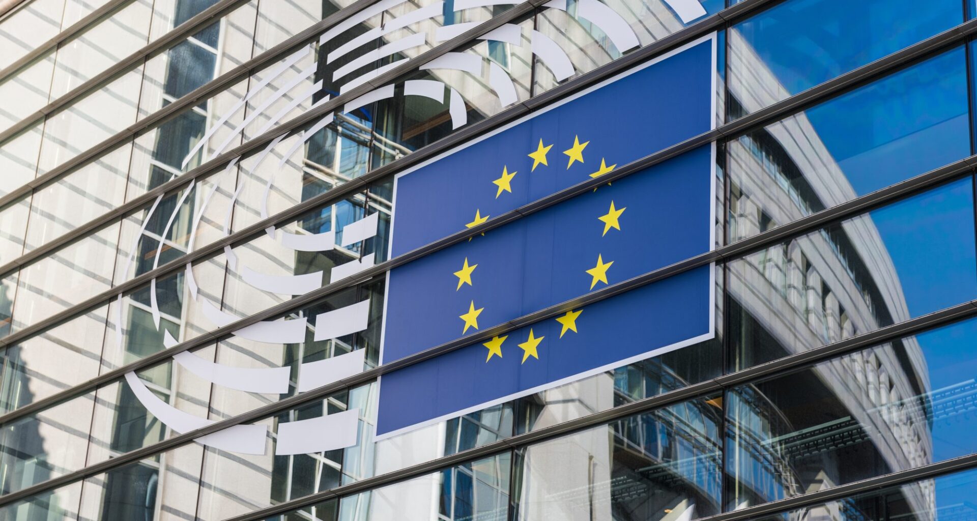The symbol of the European Parliament on the glass façade of the European Parliament.