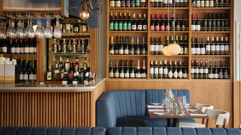 wine-filled shelves spanning the walls of london's cheapest michelin-starred restaurant