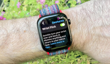 Close-up of an Apple Watch 10 on a user's wrist showing the menu option to turn on the new Wrist Flick gesture in watchOS 26