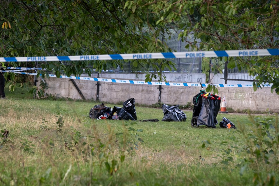 24/07/2025..NINTCHDBJOBS000001126463 - evening cover..Police at scene of shooting at Hailesland Gdns Edinburghsee sty Gordon Tait...Kids had been doing a park clean-up when shooting happened.bags of rubbish..