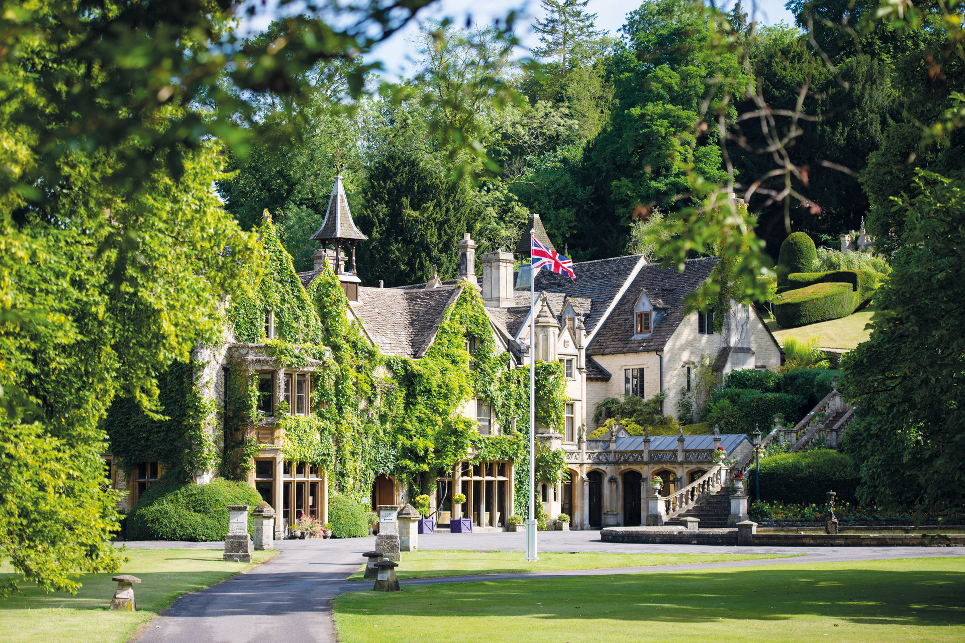Exterior of The Manor House surrounded by greenery