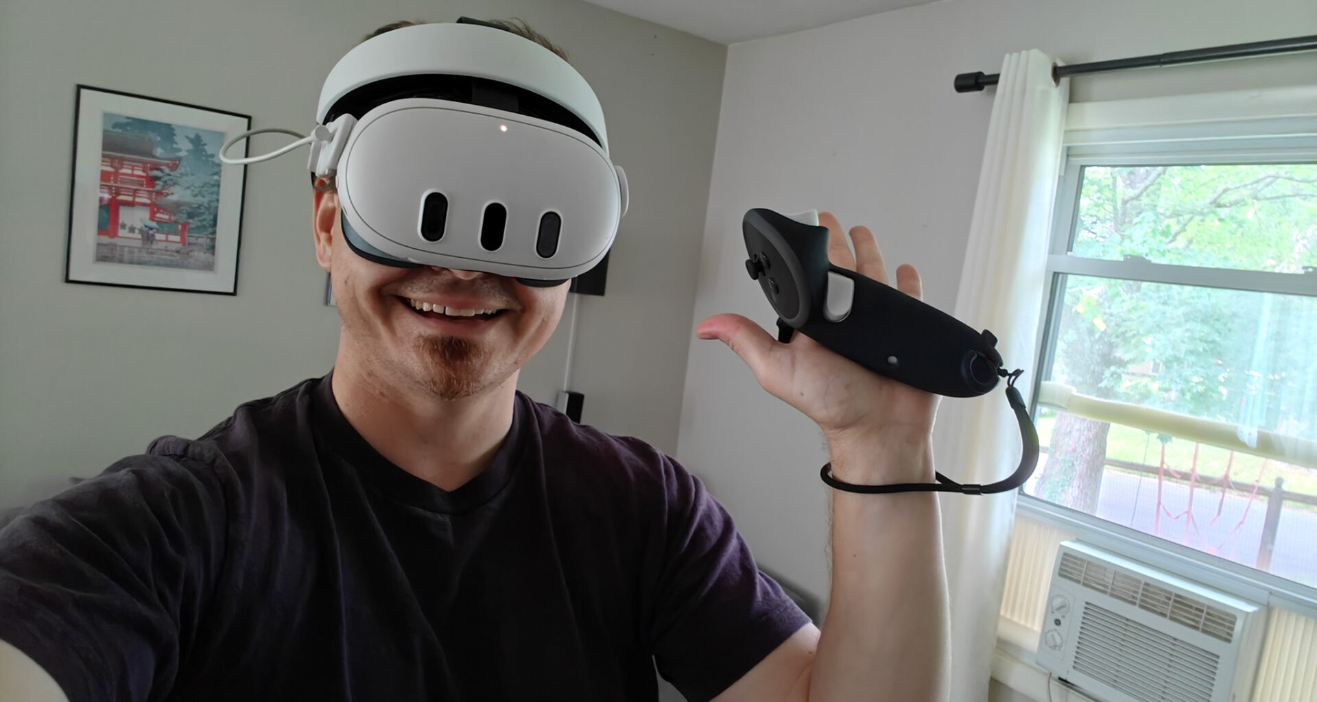 Wearing a Meta Quest 3 headset and holding a controller with the Kiwi Design G4 Max grips on it