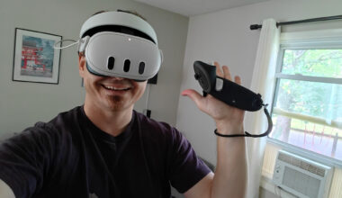 Wearing a Meta Quest 3 headset and holding a controller with the Kiwi Design G4 Max grips on it