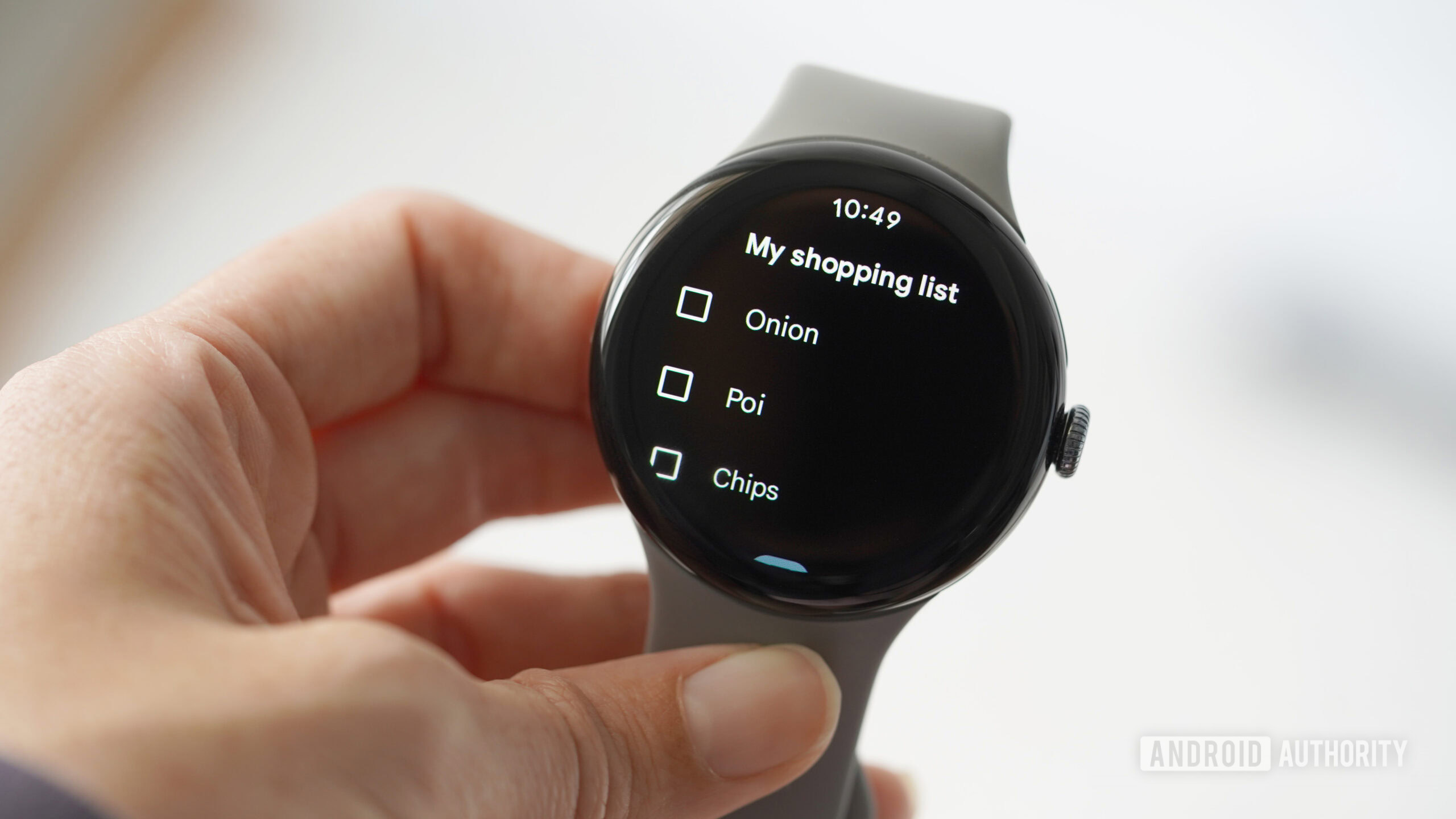 A Wear OS reviews their shopping list in Google Keep.