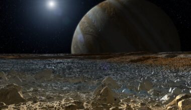 An illustration of the rocky surface of Europa with Jupiter in the background