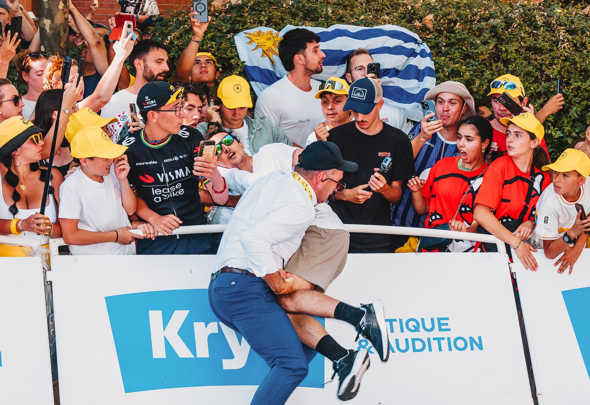 In photos: How a Tour de France executive rushed to remove protestor from finale