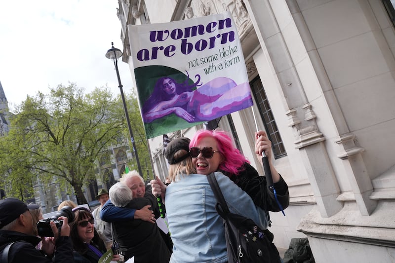 Campaigners for For Women Scotland celebrate outside the Supreme Court in London