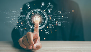 A stylized image of an unidentified person pressing a rendered 'AI button' in the air, with digital traces, icon, and other images surrounding the button.