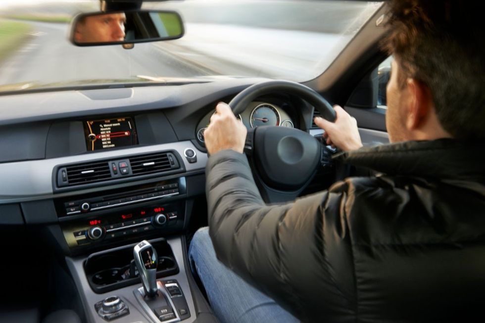 A man driving a car