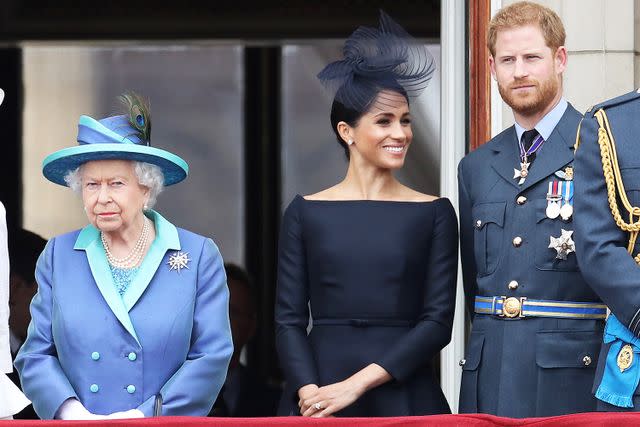 Chris Jackson/Getty Queen Elizabeth, Meghan Markle and Prince Harry on the balcony of Buckingham Palace to mark the Centenary of the RAF on July 10, 2018 in London.
