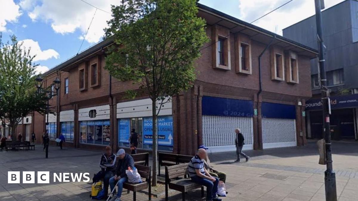 A closed former Boots store occupying a corner plot in a modern building