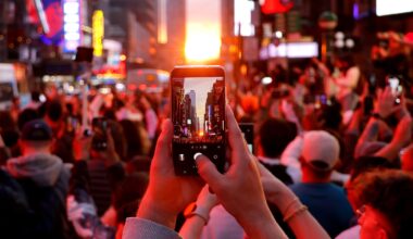 A crowd looks at the sunset in Manhattan