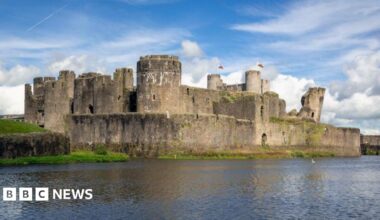 The outside of Caerphilly Castle, which has a large moat running outside it