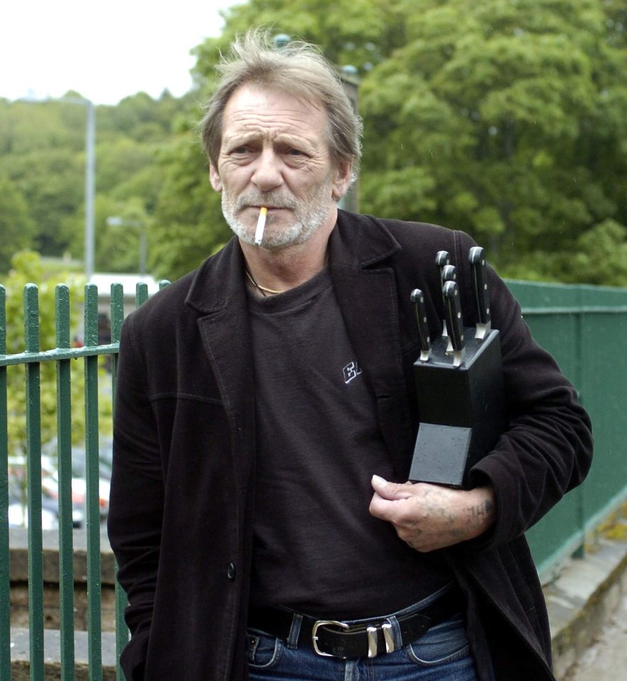 Archie Mad Dog McCafferty holding a knife block.