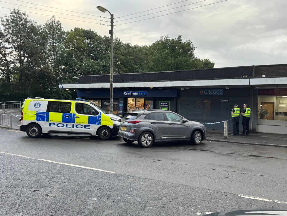 Police at the scene of an armed robbery at a Scotmid Coop in Glasgow.
