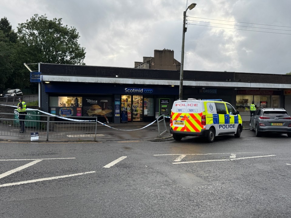 Police at the scene of an armed robbery at a Scotmid Coop in Glasgow.