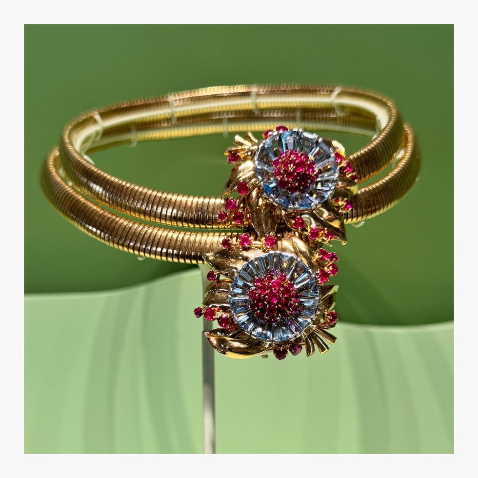 Van Cleef Jewelry displaying floral design elements with gemstones.
