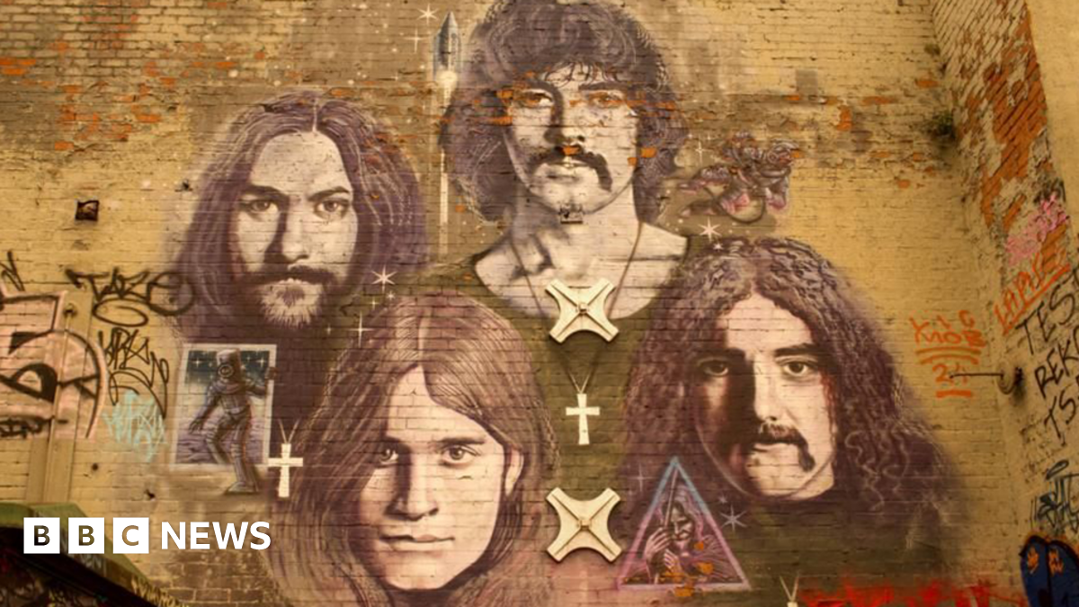 A mural on a brick wall of Black Sabbath band members