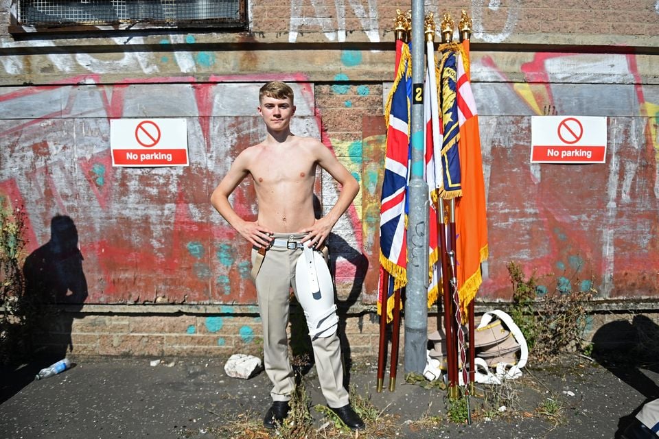 A member of a flute band prepares to take part in the annual Twelfth of July parade on July 12, 2025 in Belfast. (Photo by Charles McQuillan/Getty Images)