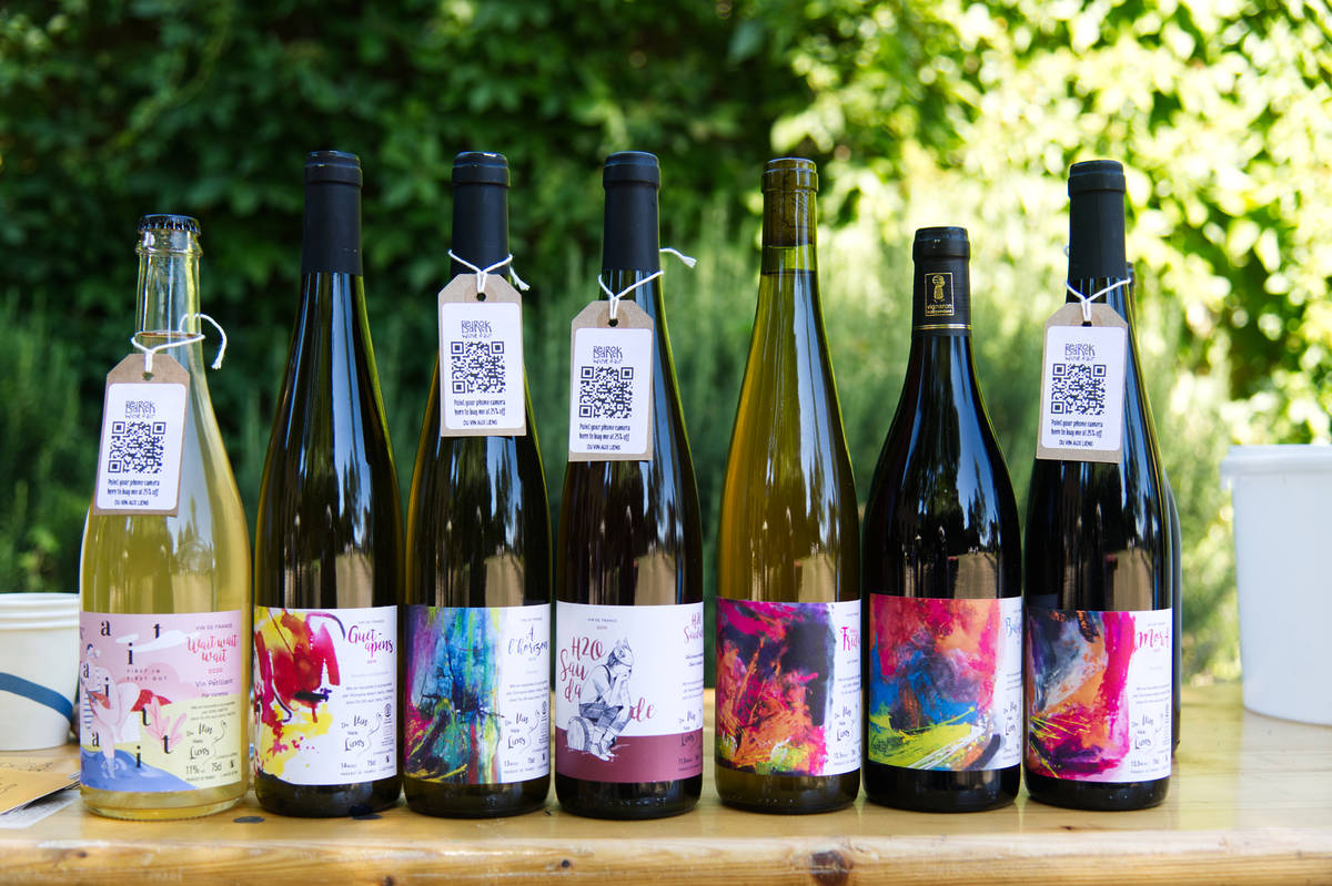 attractive bottles of wine lined up on a table