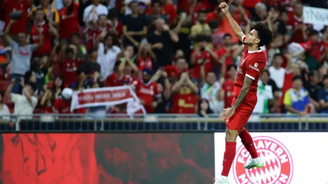Luiz Diaz jumping in the air