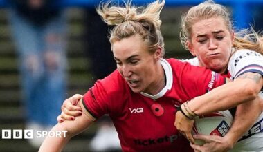 Beth Dainton on Wales is tackled against England