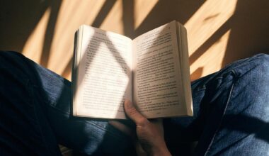 A person sitting cross-legged holding a book open. Publishing after book rejection