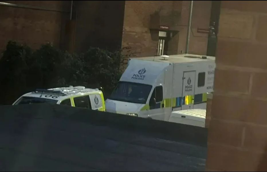 Police vehicles in Braid Square, Glasgow.