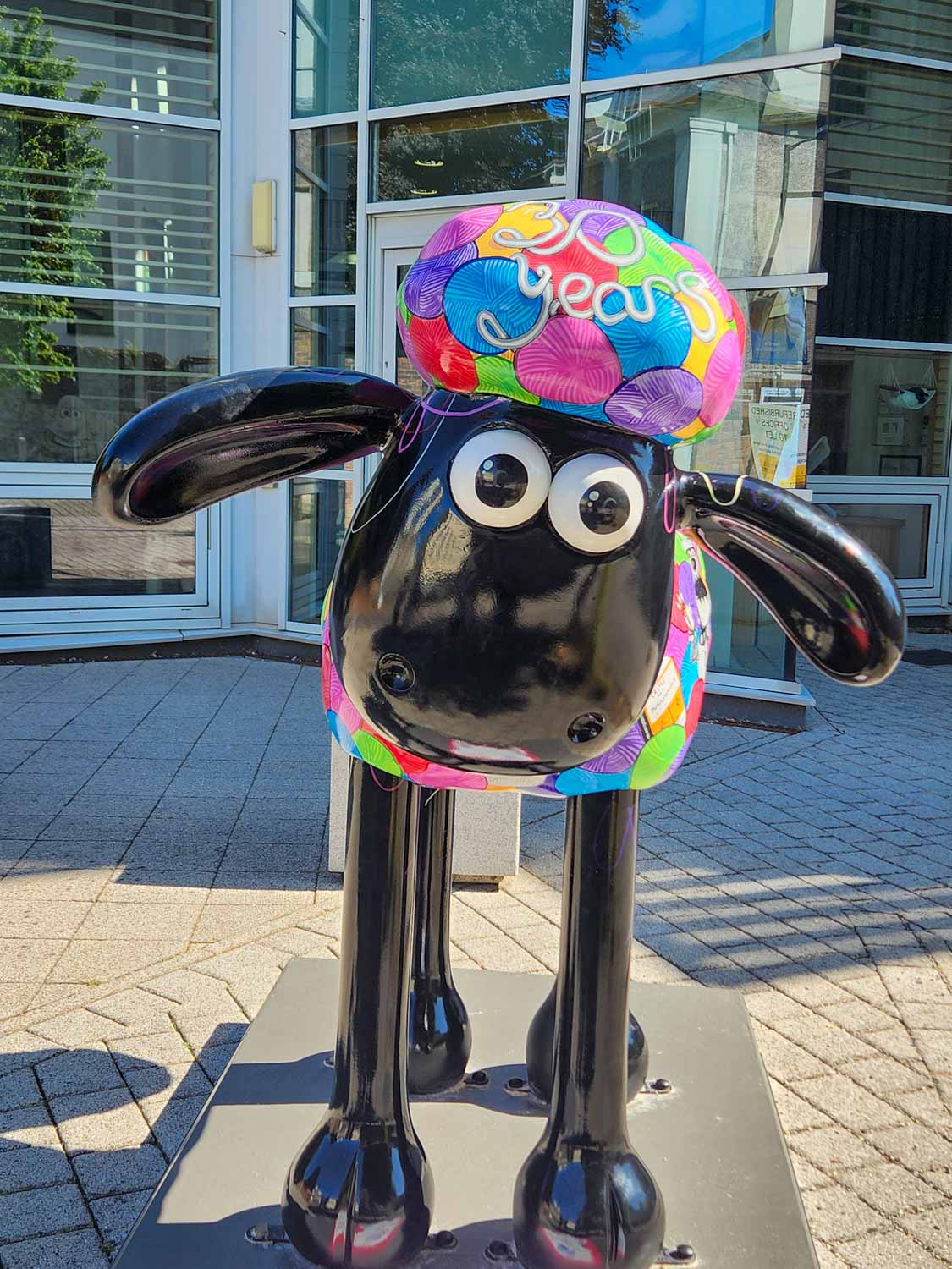 Brightly coloured statue of Shaun the Sheep outside Aardman Animation studios - one of the unusual additions to the Gromit Unleashed 3 trail