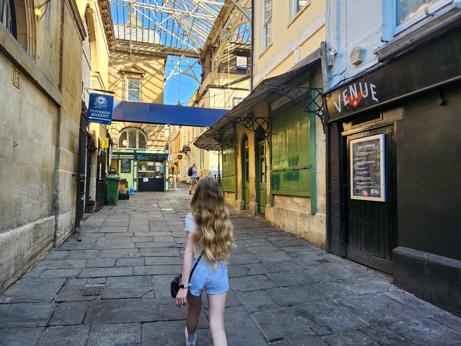 My daughter walks into St Nicholas Market in the early morning on the search for statues in the Gromit Unleashed 3 trail - my review