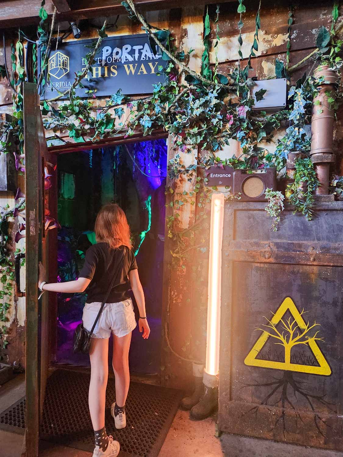 My daughter enters the portal into Wake The Tiger - one of the most unusual things to do in Bristol with kids
