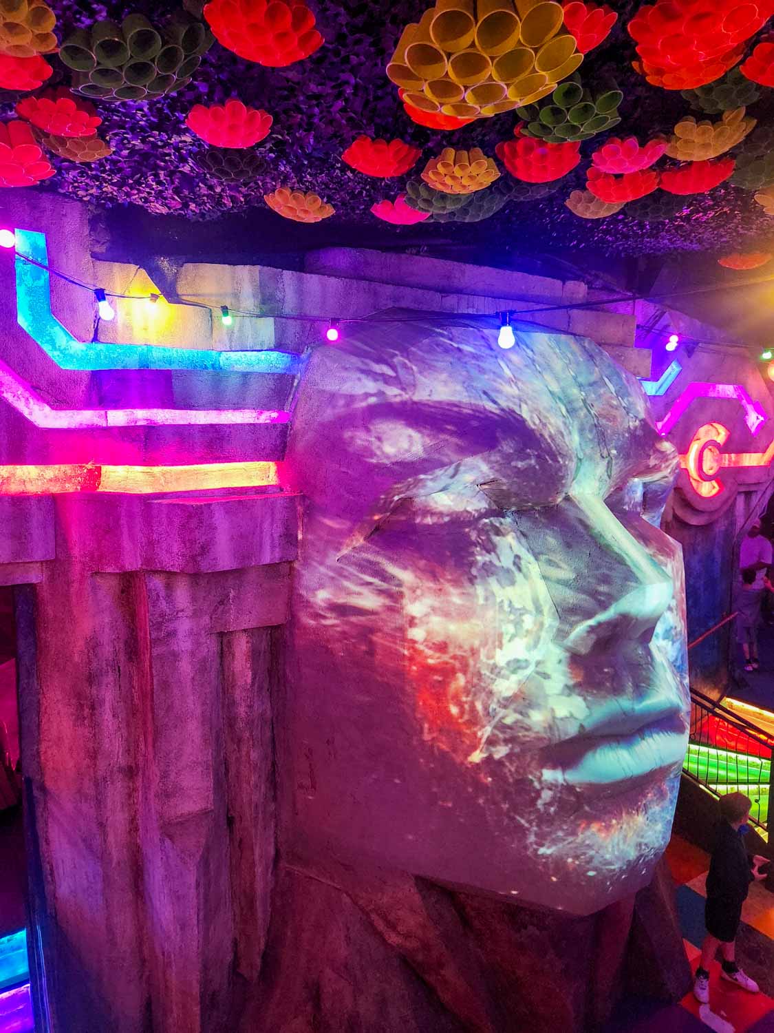 Colourful holographic face at Wake The Tiger - one of the most unusual things to do in Bristol with kids