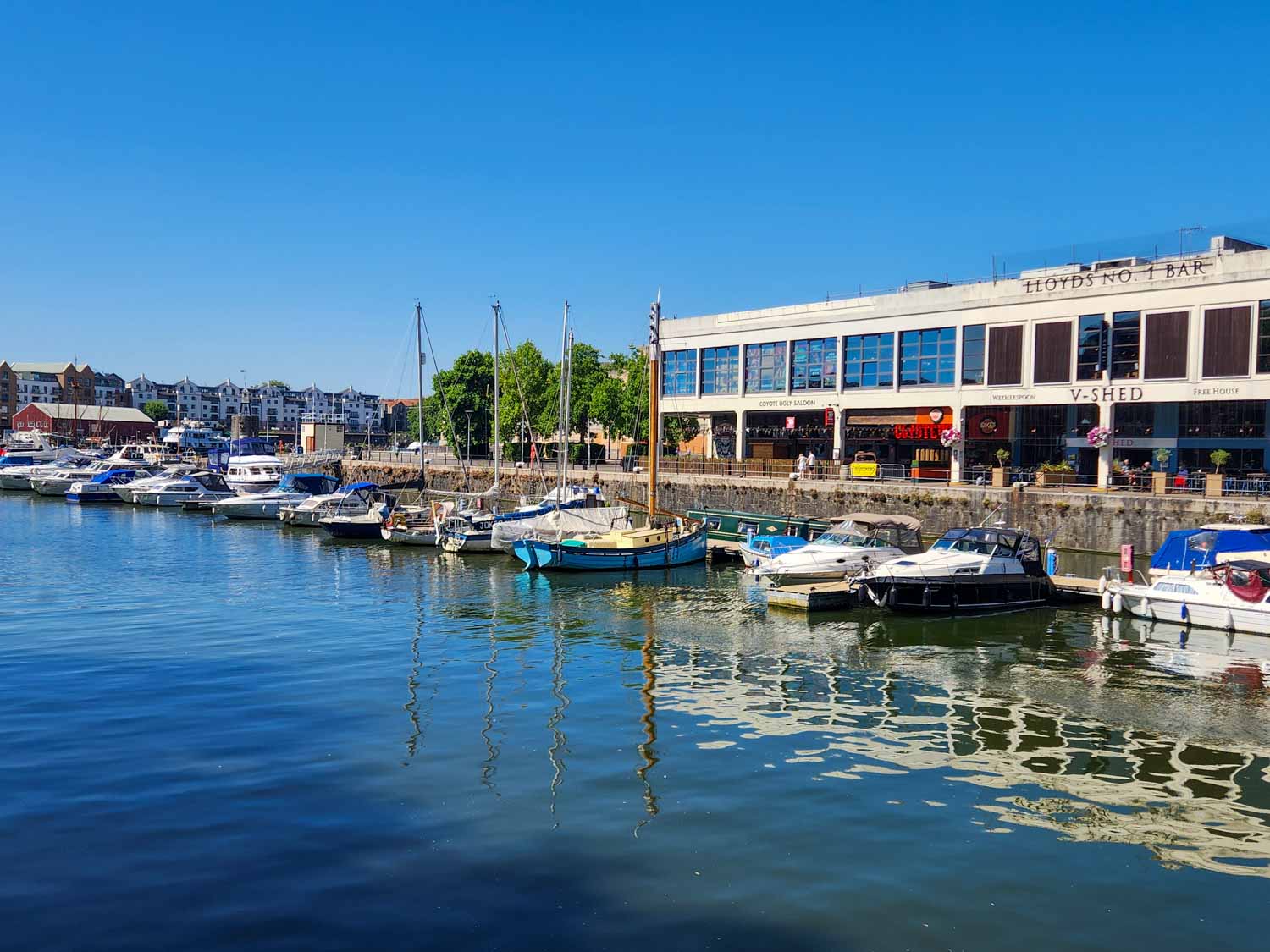 View of boats by one of the restaurants on the Harbourfront in Bristol on a sunny summer's day during our short break in Bristol with kids