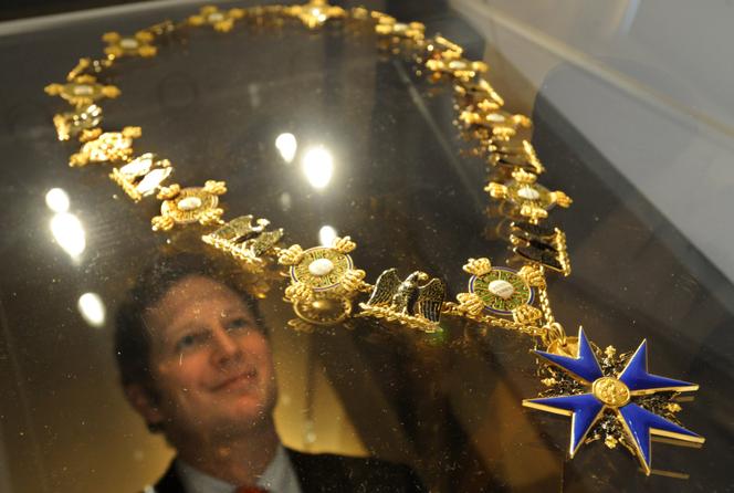 The head of the royal house and great-great-grandson of Emperor Wilhelm II, Georg Friedrich of Prussia, examines the Order of the Black Eagle medal, one of the jewels of the Prussian crown, at Oranienburg Castle, Germany, January 2009.