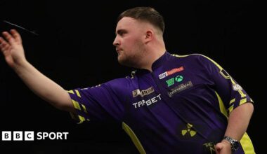 Luke Littler throws a dart