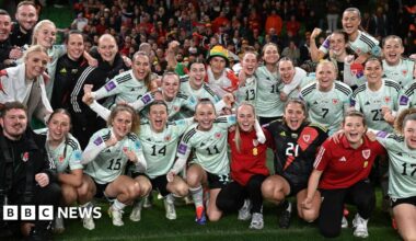 Players of Wales pose for team a photo following victory in the UEFA Women's EURO 2025.