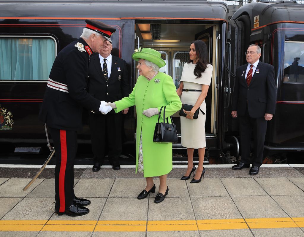 Meghan and late Queen disembarking from royal train