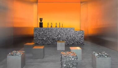 warm orange glow bathes crosby studios' chromatic café in paris 