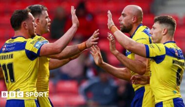 Warrington players celebrate a try by James Harrison (second right)