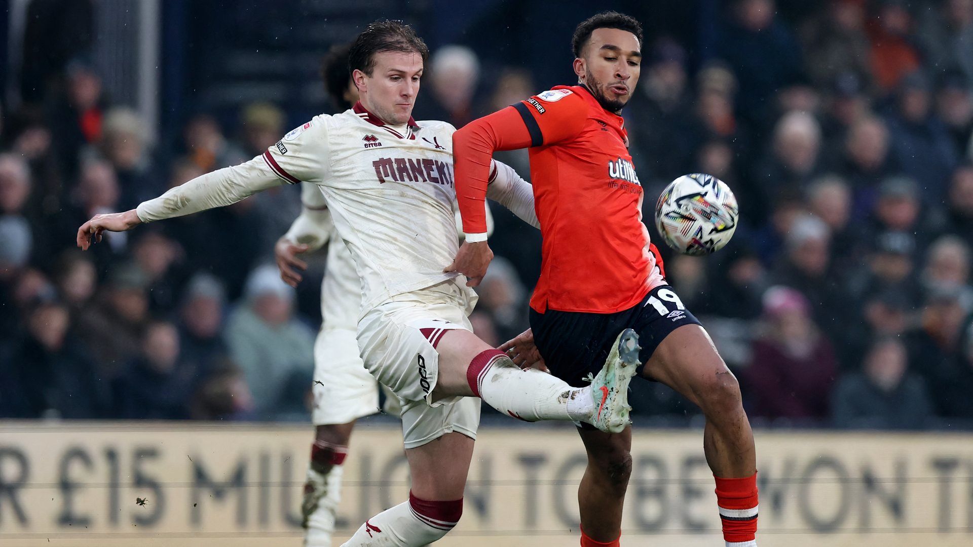 Luton Town's Jacob Brown in action with Sheffield United's Rob Holding