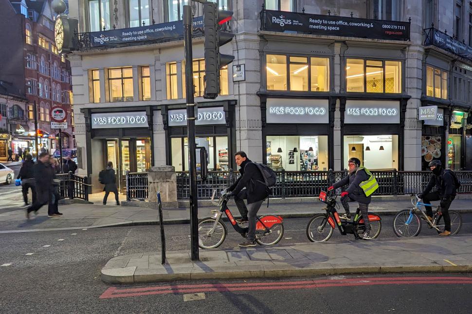 Cyclists in London stopped at red light 