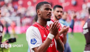 Jorrel Hato applauds the crowd after an Ajax match