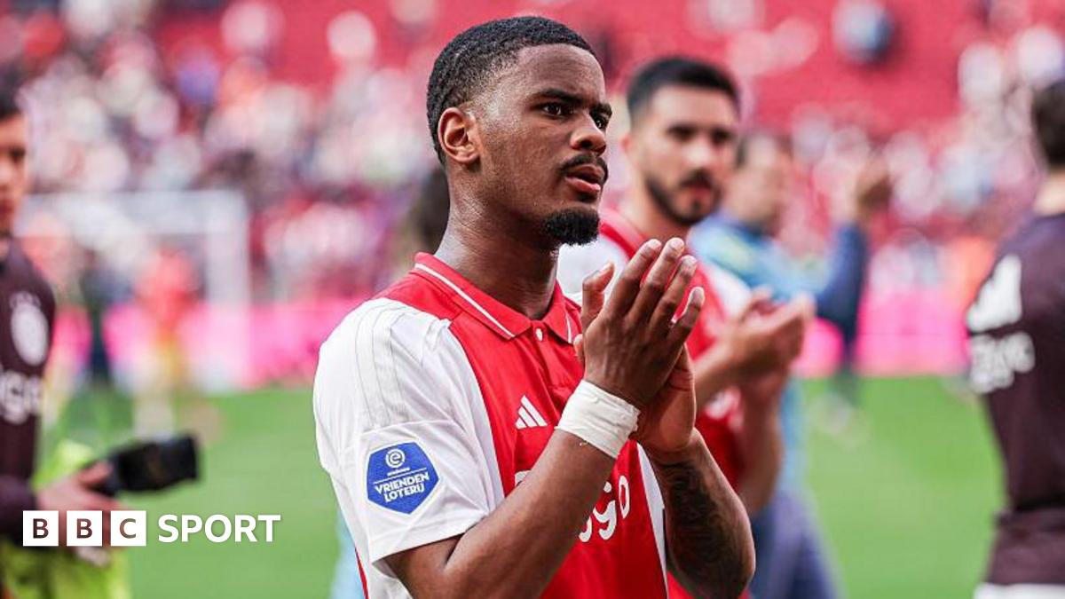 Jorrel Hato applauds the crowd after an Ajax match