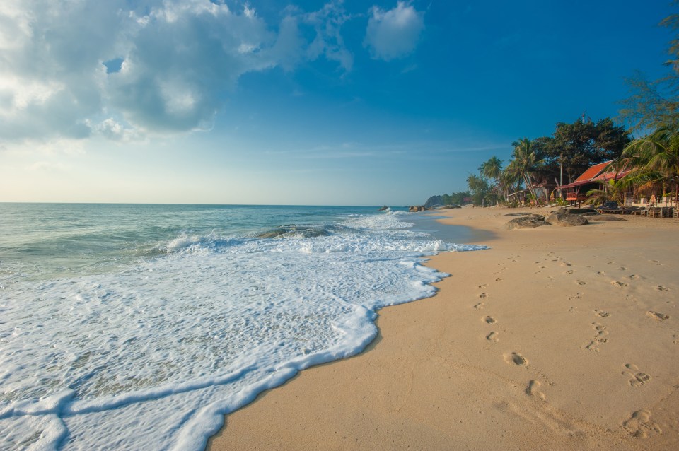 Footsteps in the sand on Lamai Beach, Koh Samui.