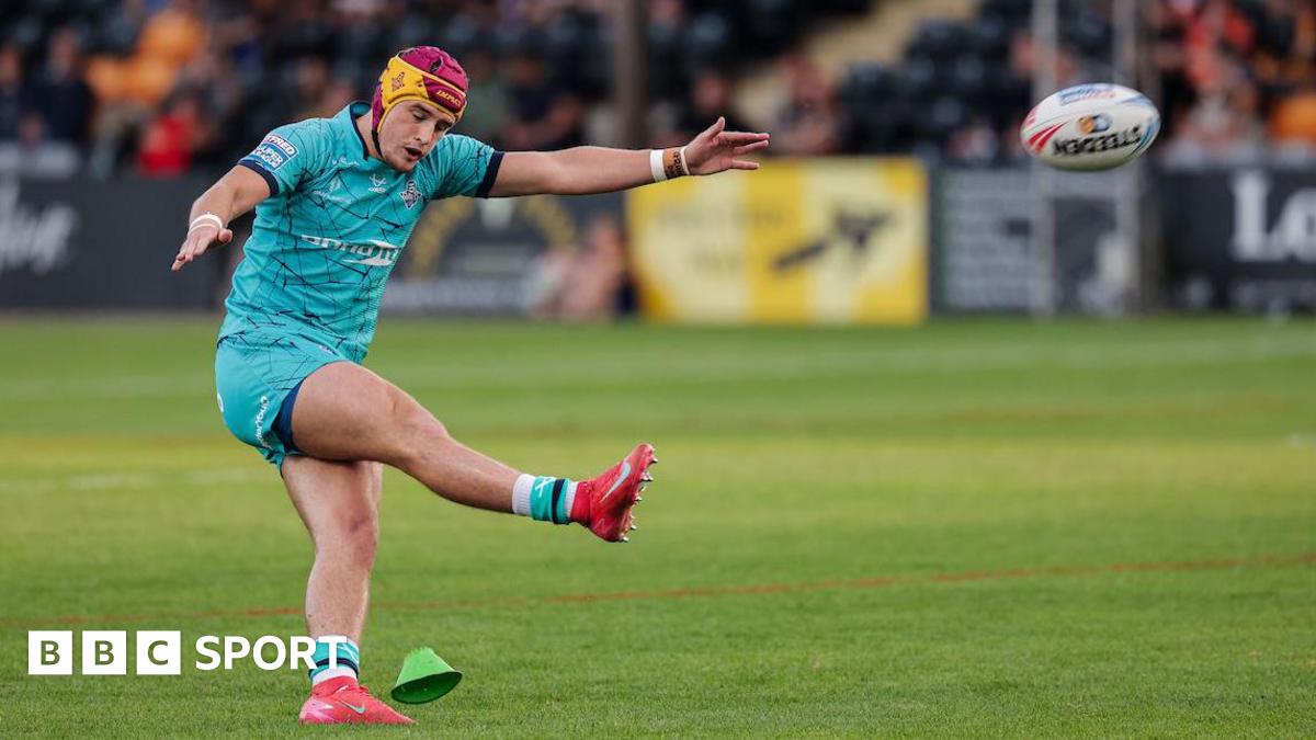 Huddersfield Giants player George Flanagan kicks a conversion against Castleford Tigers.