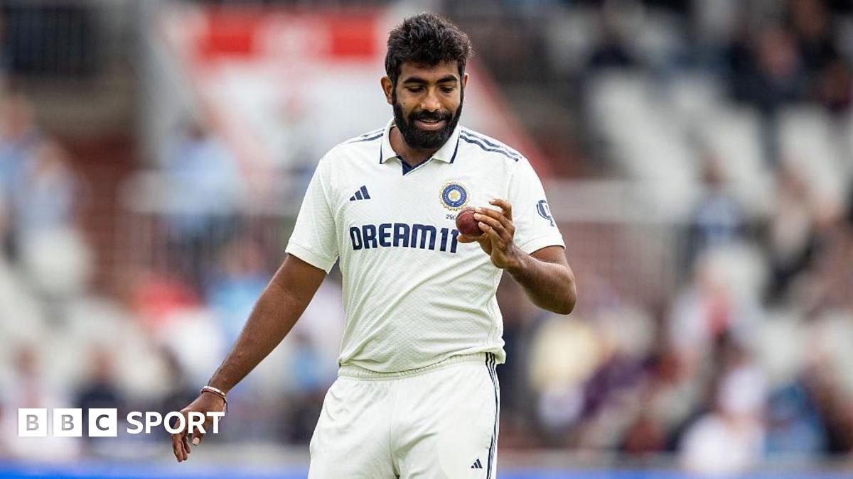 Jasprit Bumrah looks at the ball
